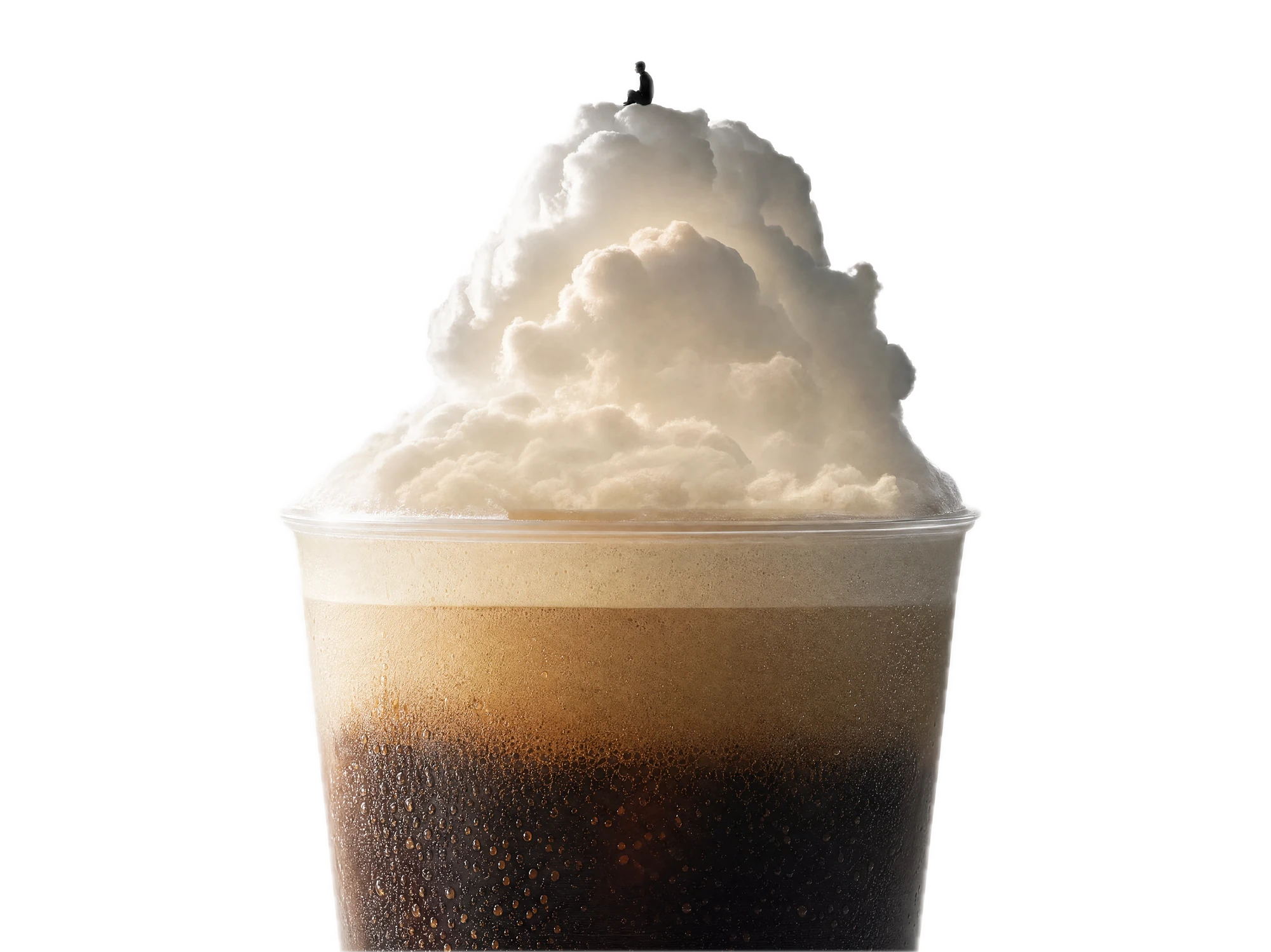 A cup of iced coffee crowned with a towering cloud of foam.